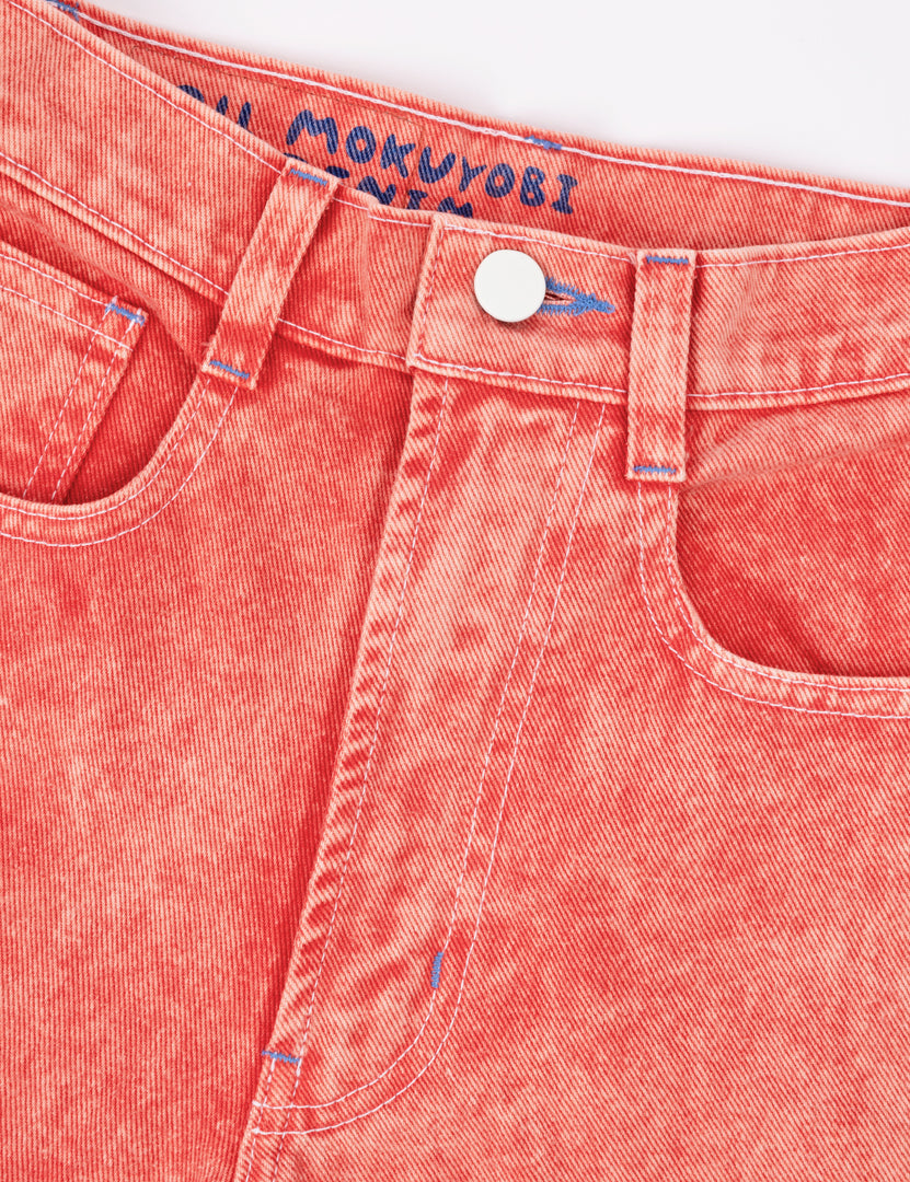 Close up picture of Cherry acid wash jeans 