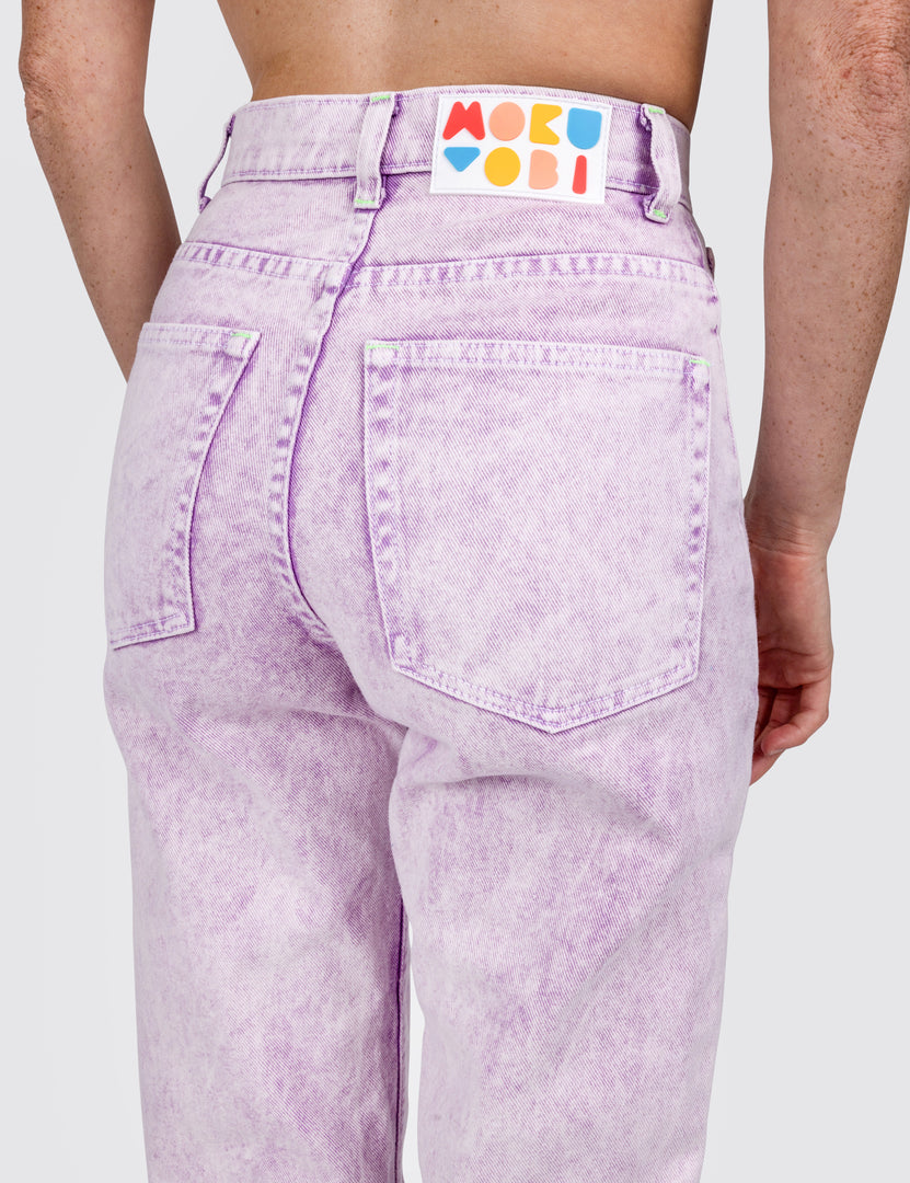 Back view of women wearing light purple jeans