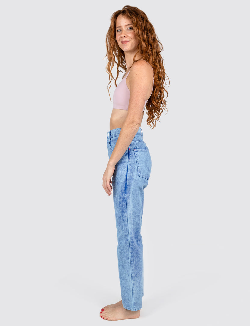 Side view of women wearing blue jeans