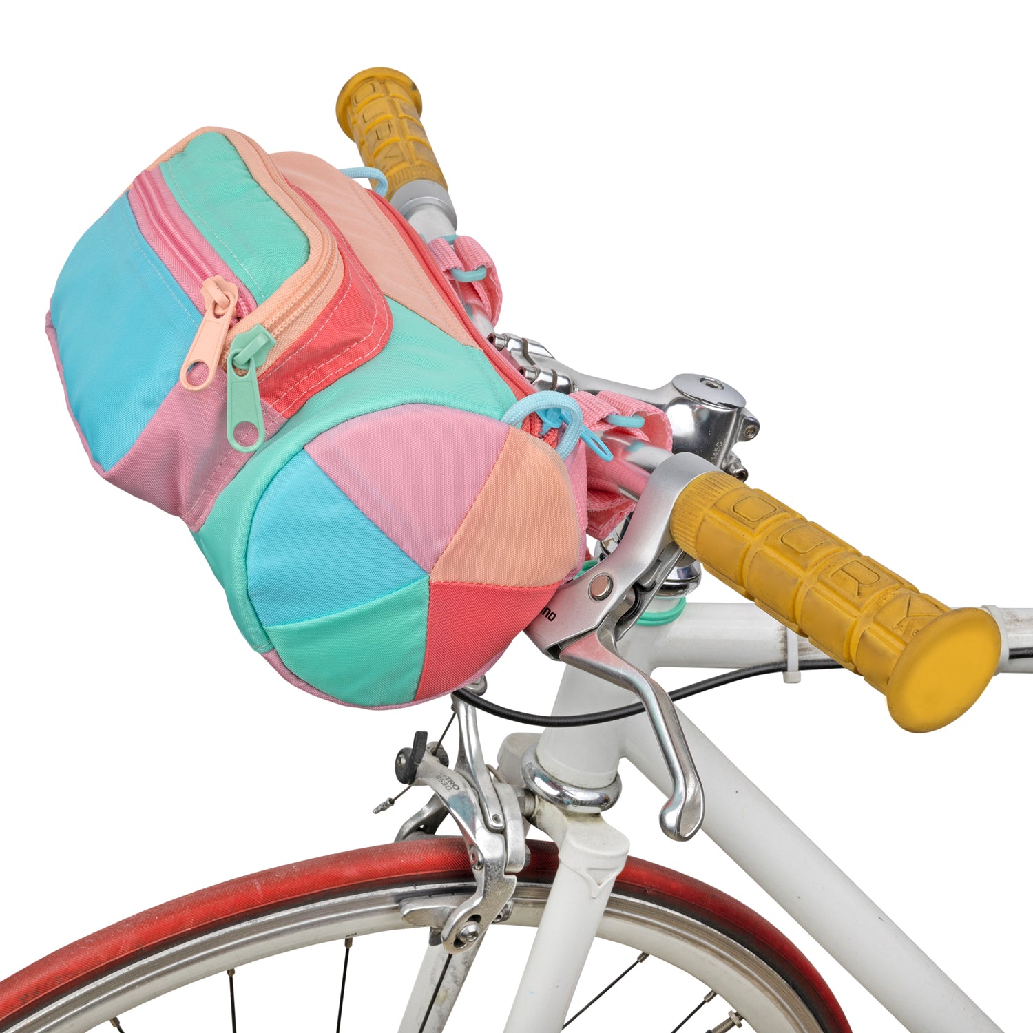 A colorful bike bag perched on bike handle bars