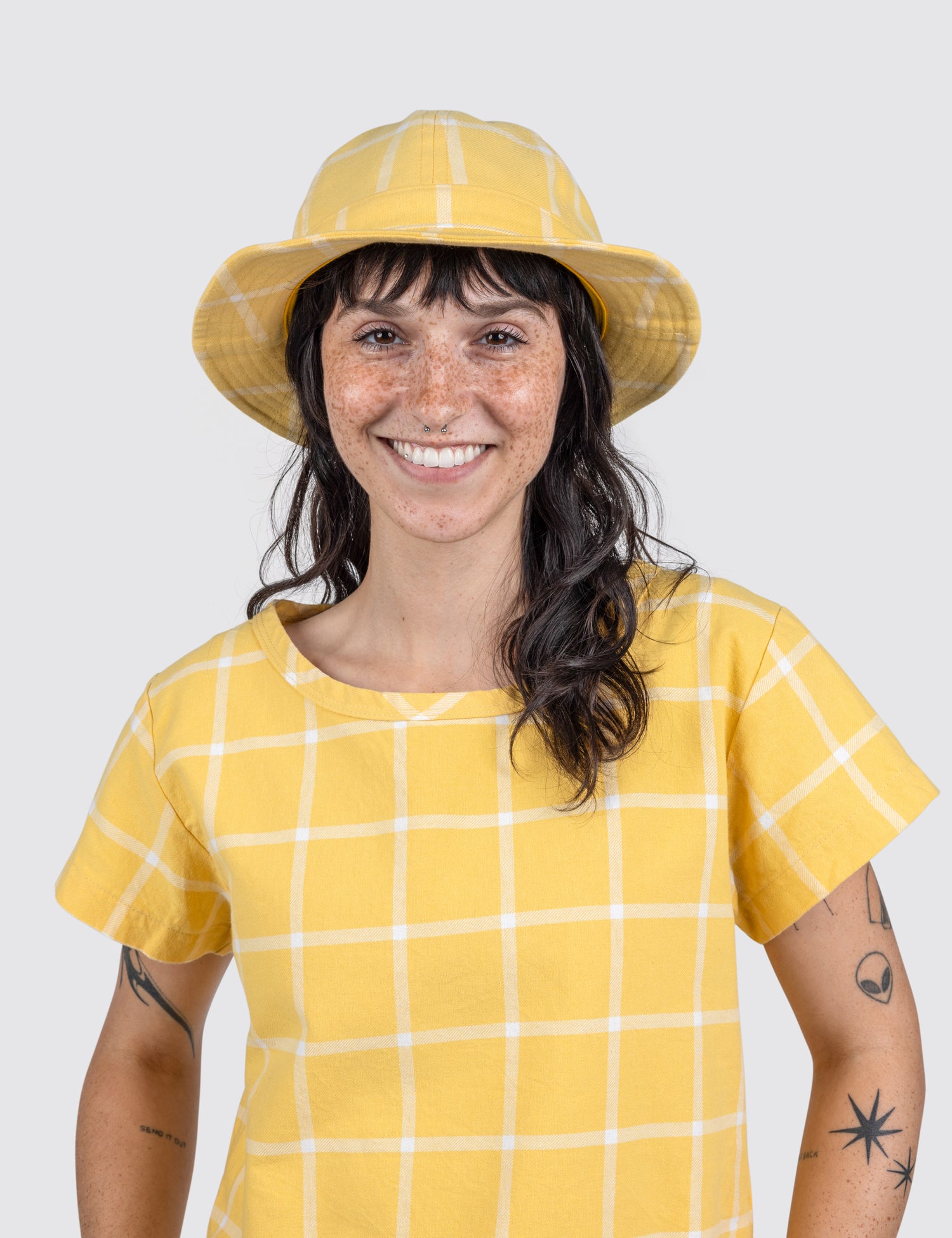 woman in a yellow Grid Hat