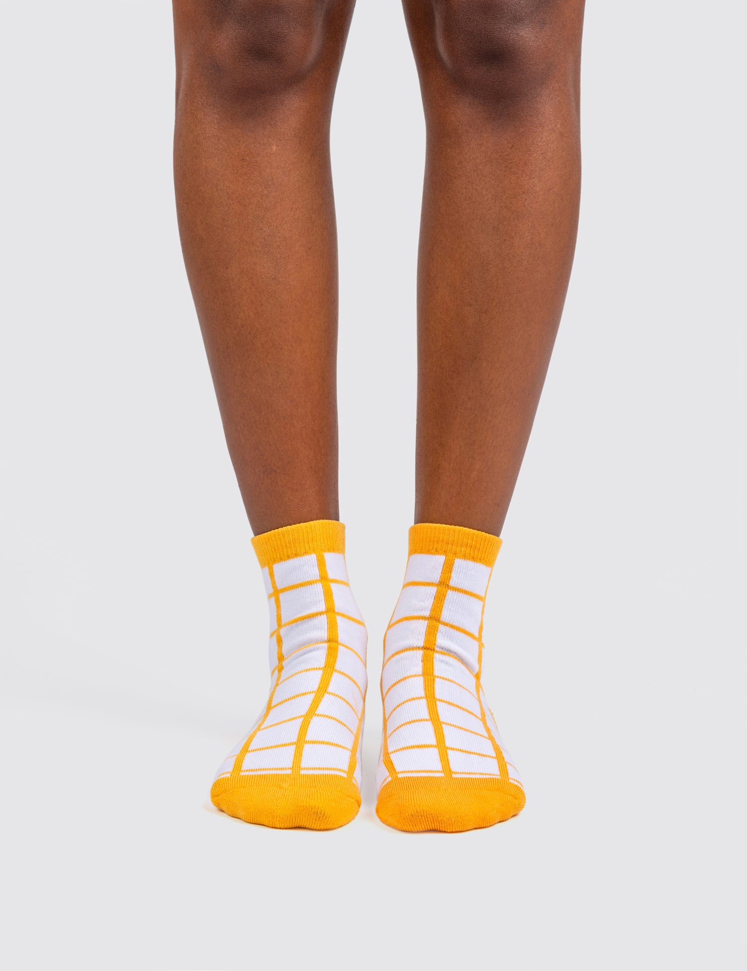 Woman's feet wearing the grid socks 