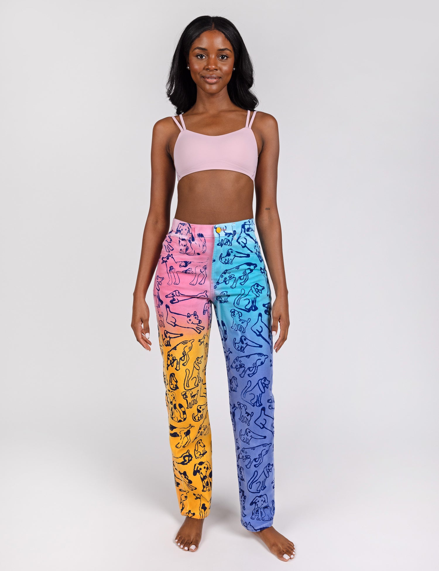 Woman wearing colorful dog print jeans