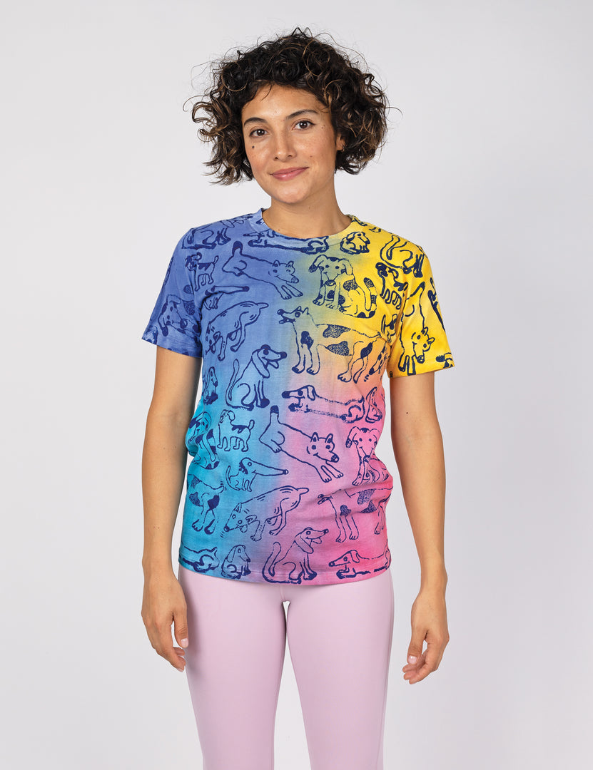 woman wearing a colorful t shirt with dog print all over.