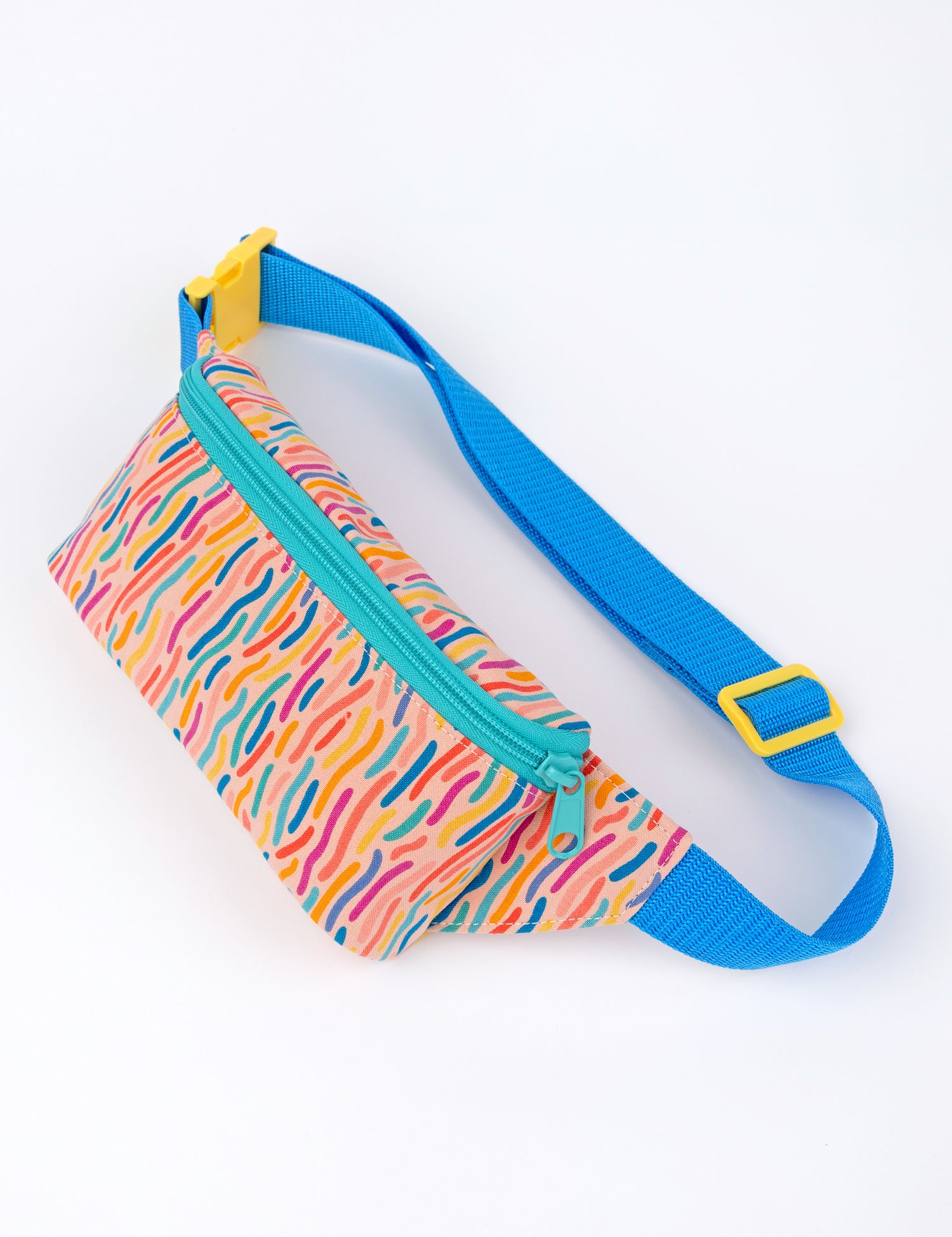 small coral colored fanny pack with confetti style colorful designs and blue straps