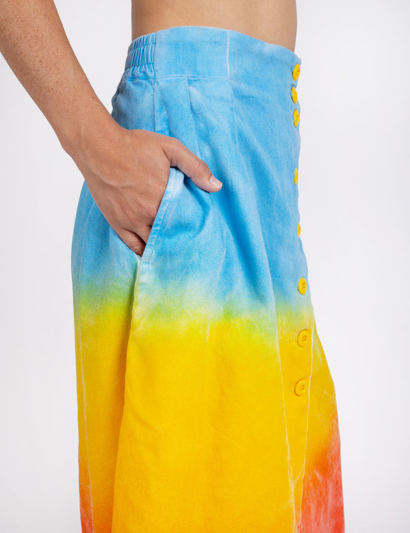 Woman wearing long sullivan skirt in gradient colors Blu,  yellow,  red
