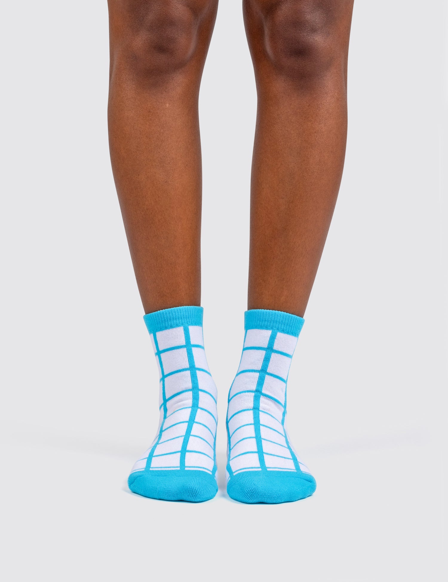 Woman's feet wearing the grid socks 