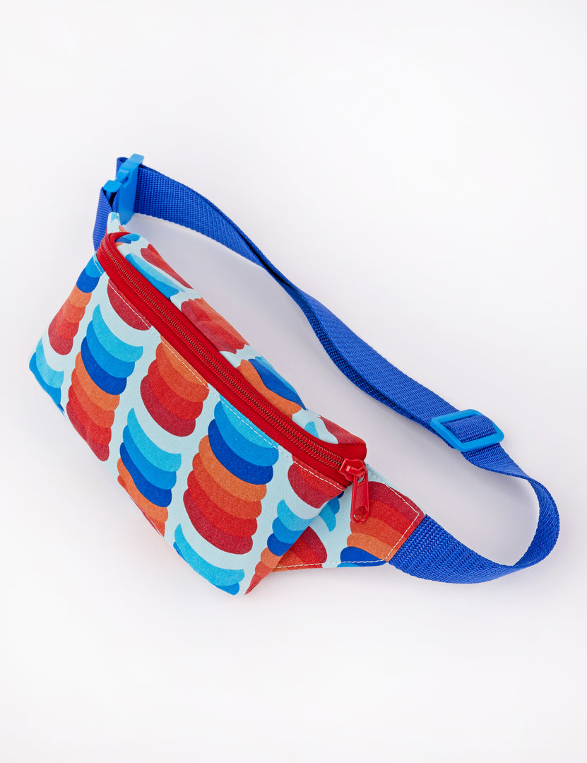 small blues and reds fanny pack with blue strap