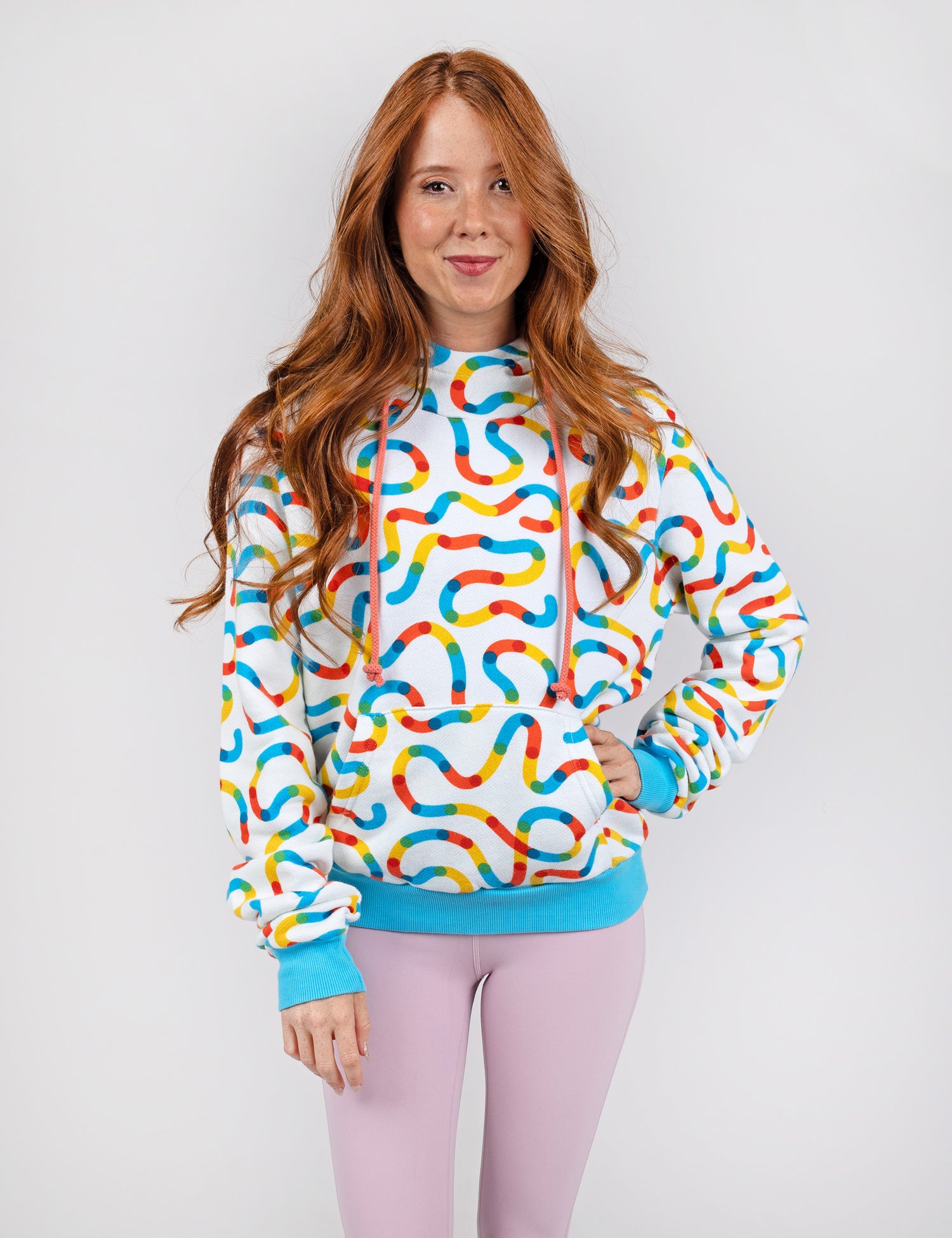 woman wearing white hoodie with colorful squiggles