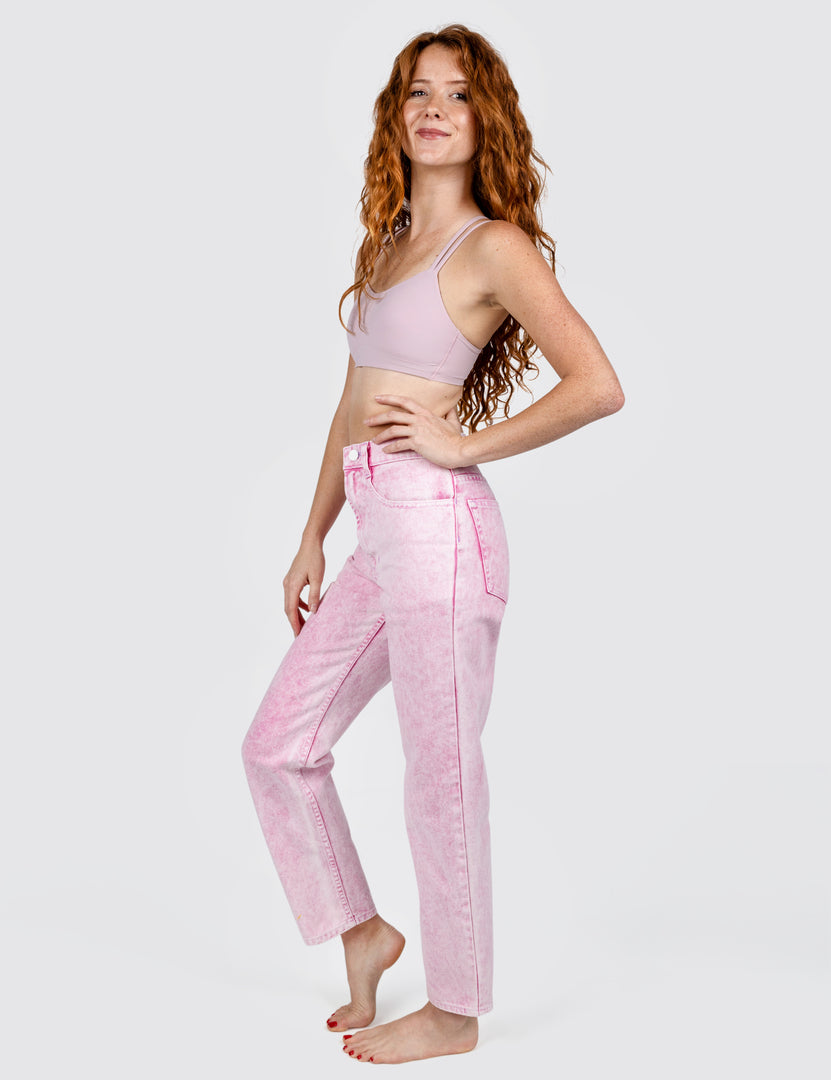 Side view  of woman wearing light pink jeans 
