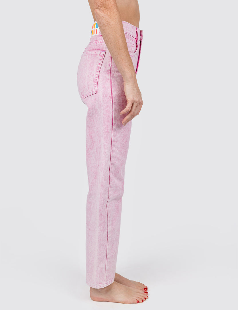 Side View  of woman wearing light pink jeans 