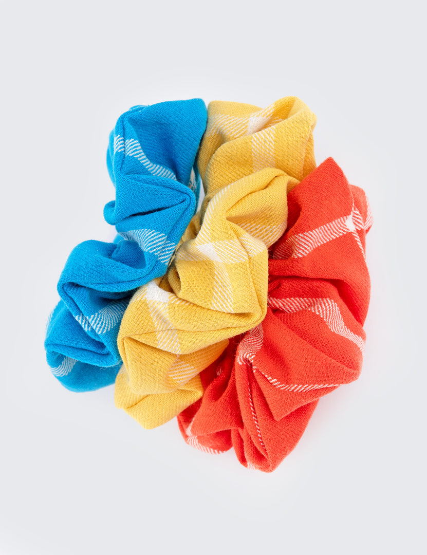 Three scrunchies blue yellow and red