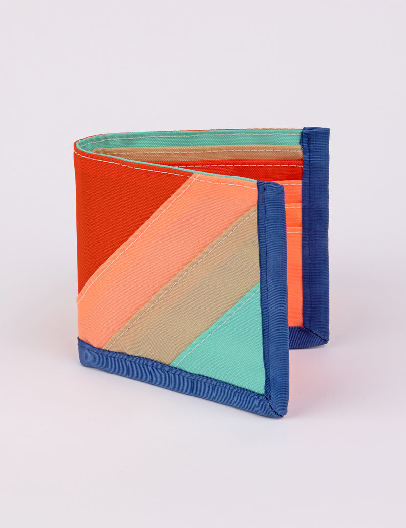 a bi-fold wallet in multiple colors