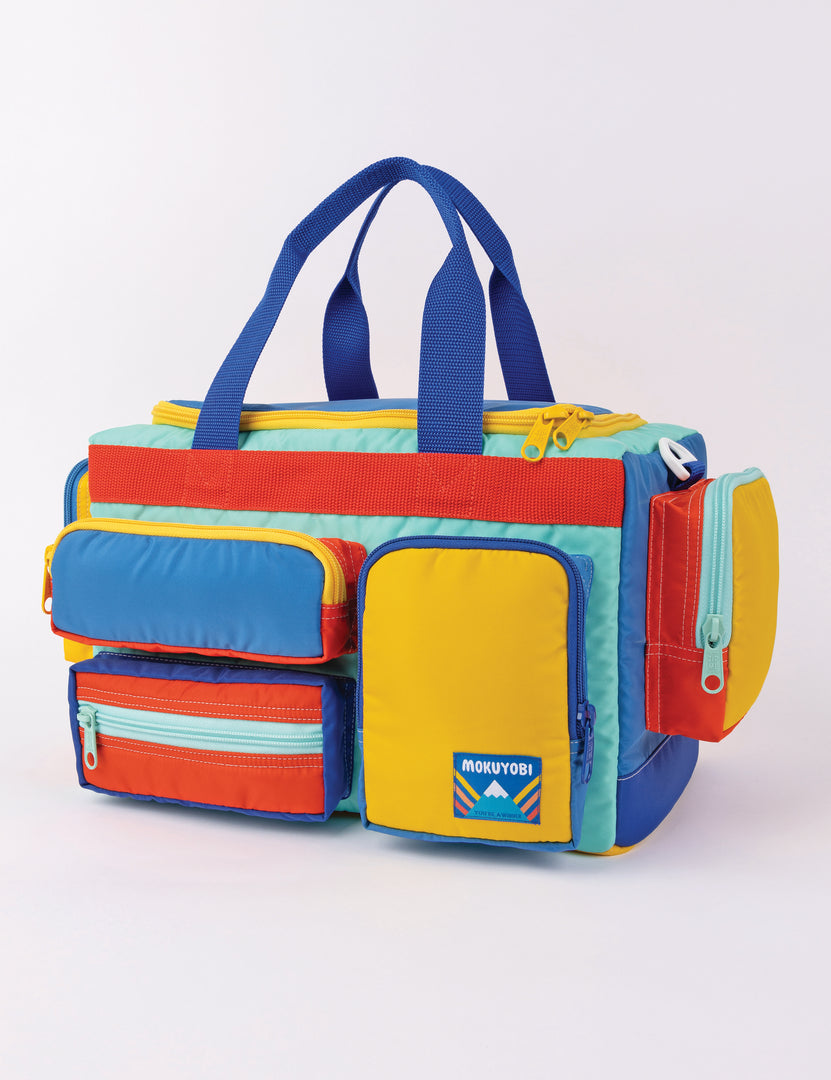camp bag with multiple pockets and straps in multiple colors