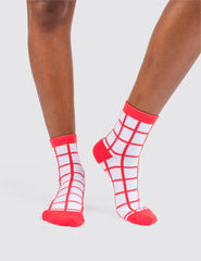 Woman's feet wearing the grid socks 