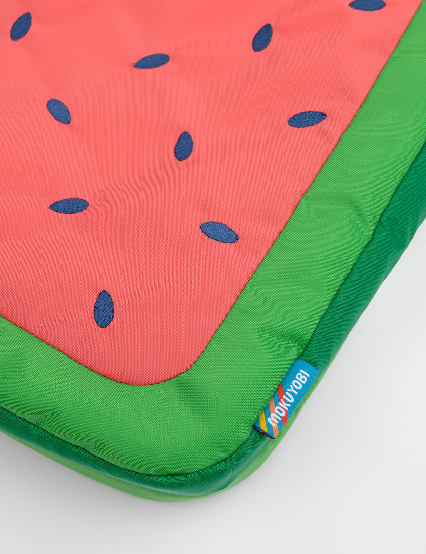 Close-up shot of the watermelon tote bag and label