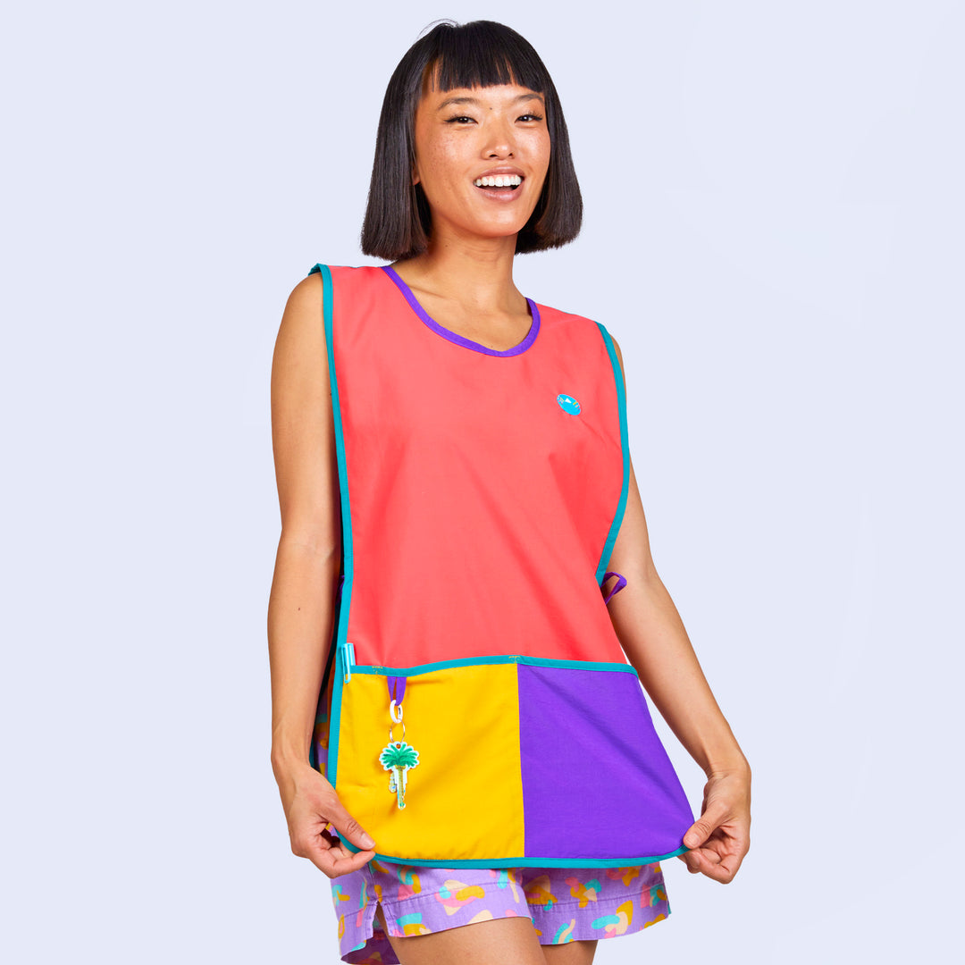 A woman wearing a color block apron